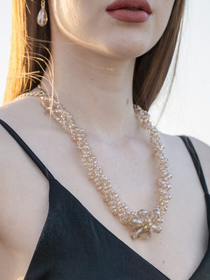 a woman wearing a necklace